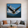 BALD EAGLE FLYING HIGH IN MOUNTAINS